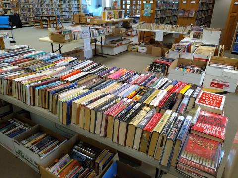 Tables full of books arranged for book sale