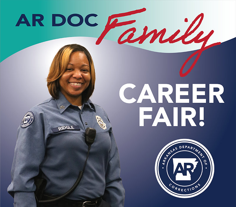 Career fair with a female correctional officer in uniform pictured.