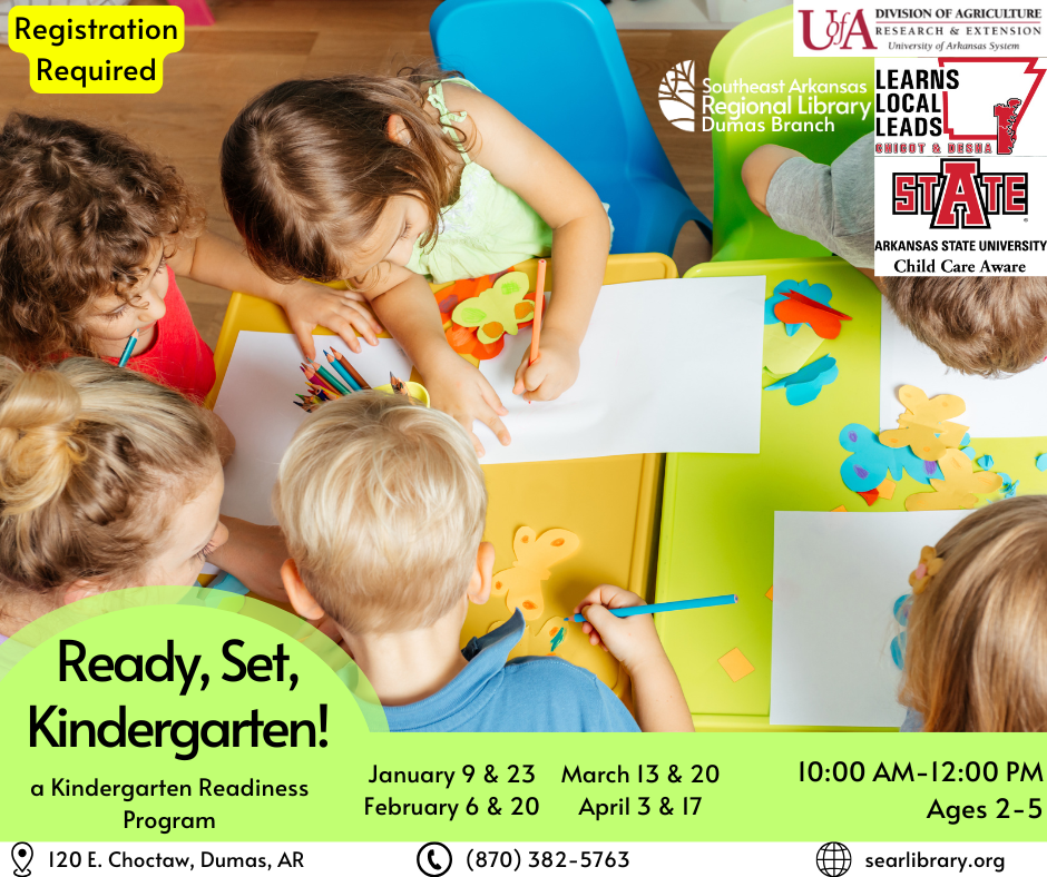 Overhead view of toddlers drawing at a table. 